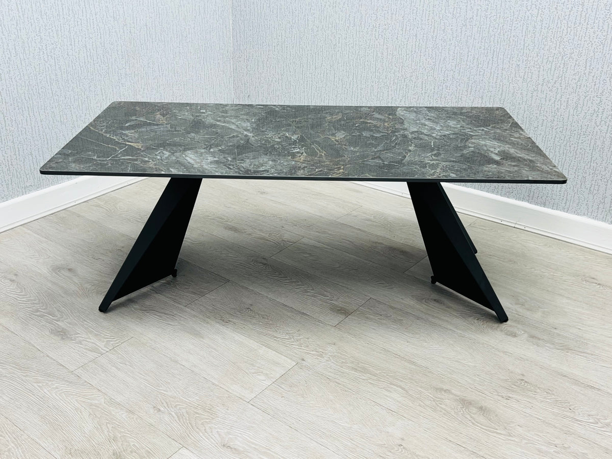 Chicago Black Ceramic Marble-Effect Coffee Table with black angular pedestal legs - angled view